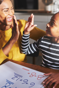 Mom high five with a child learning and guiding instead of disciplining